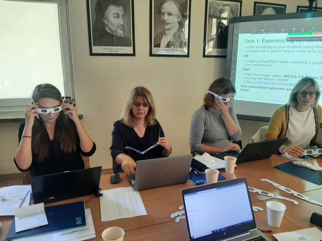 team trying on vision impairing glasses